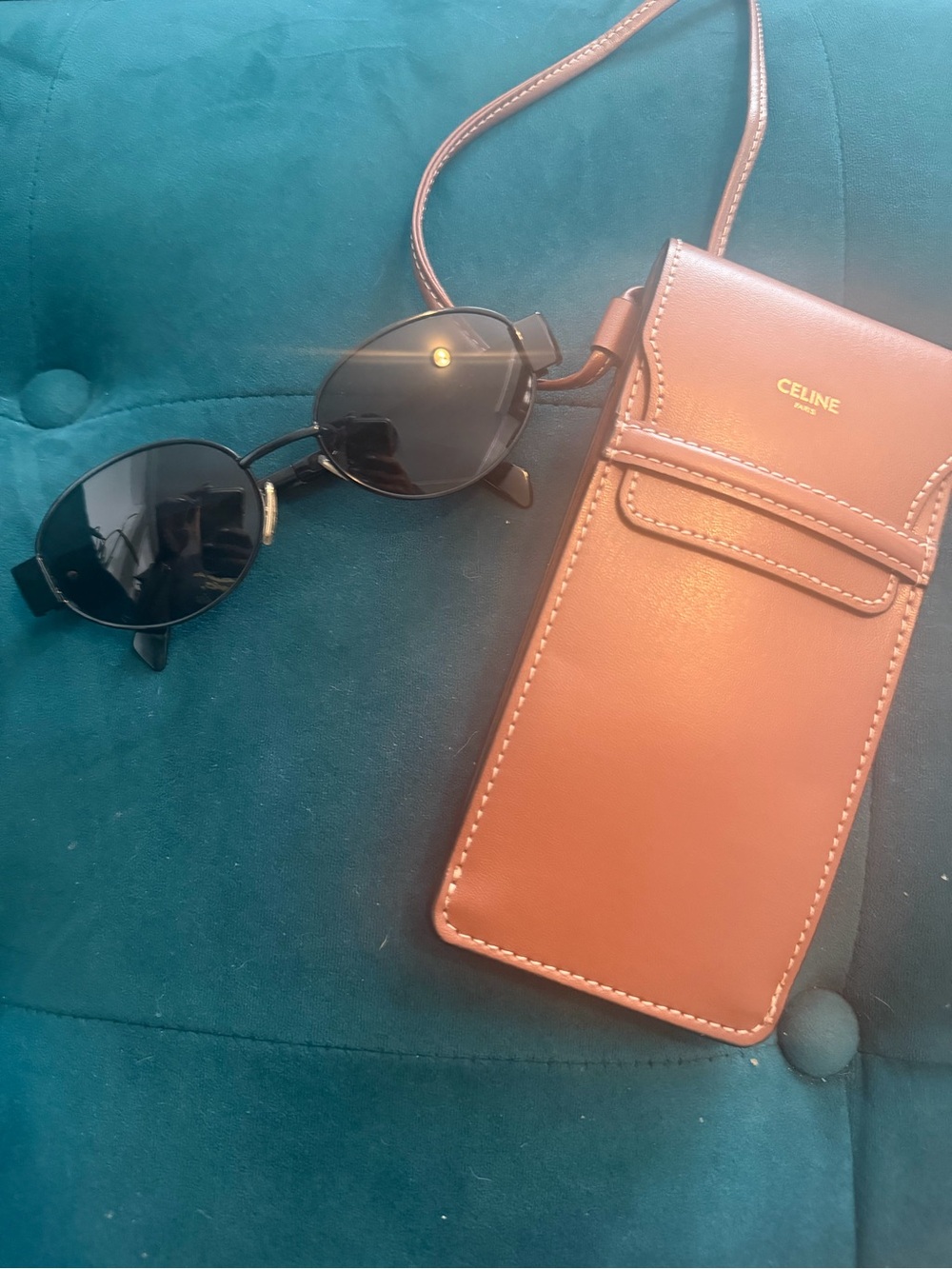 CELINE Triomph metal 01 sunglasses in black/smoke. Comes in tan leather pouch.